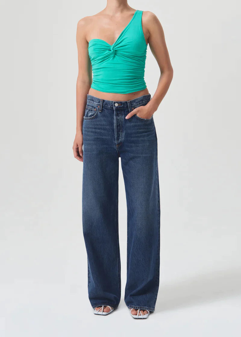 AGOLDE Domino one-shoulder top in Cactus green worn with wide-leg jeans, full front view