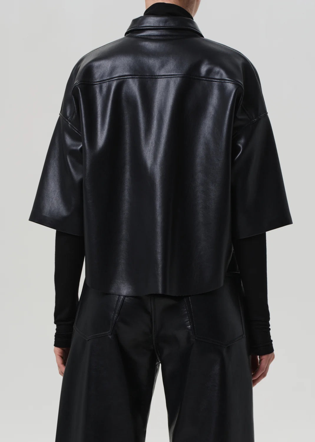 Back view of Frances Crop Cape Button Up – Black, showing cape-style back panel