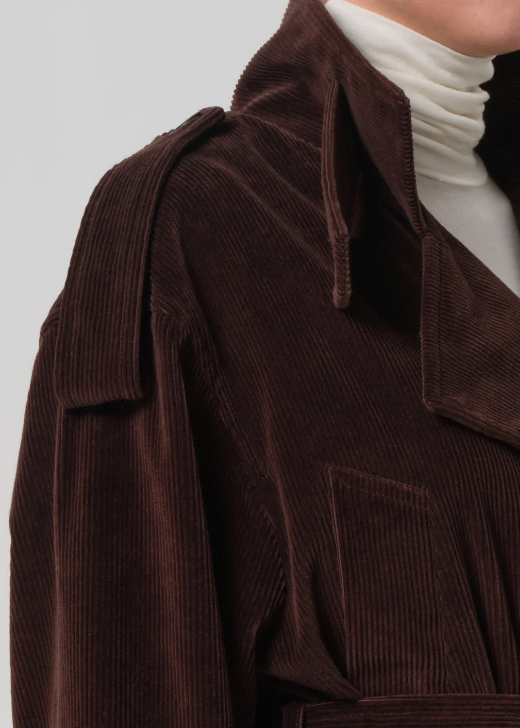 Close-up detail of fabric — velvety corduroy texture on Short Fari Trench Manuka