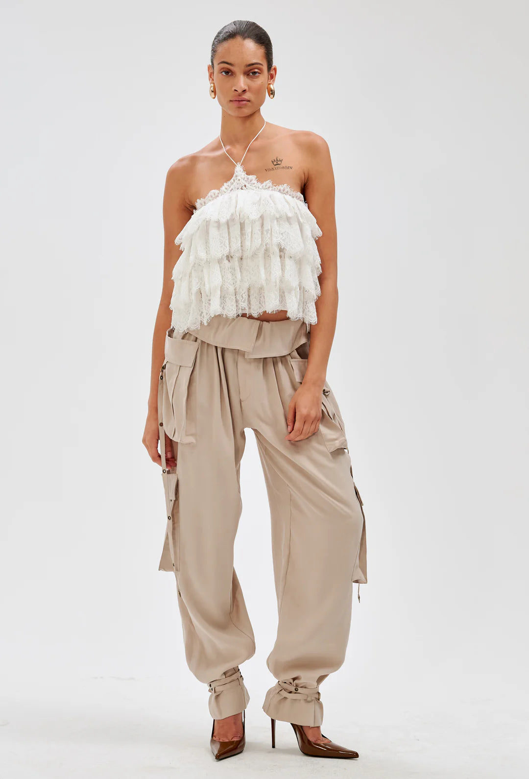 Ronny Kobo Ophelia ivory tiered lace halter top worn with beige cargo pants and brown heels, front view, full length