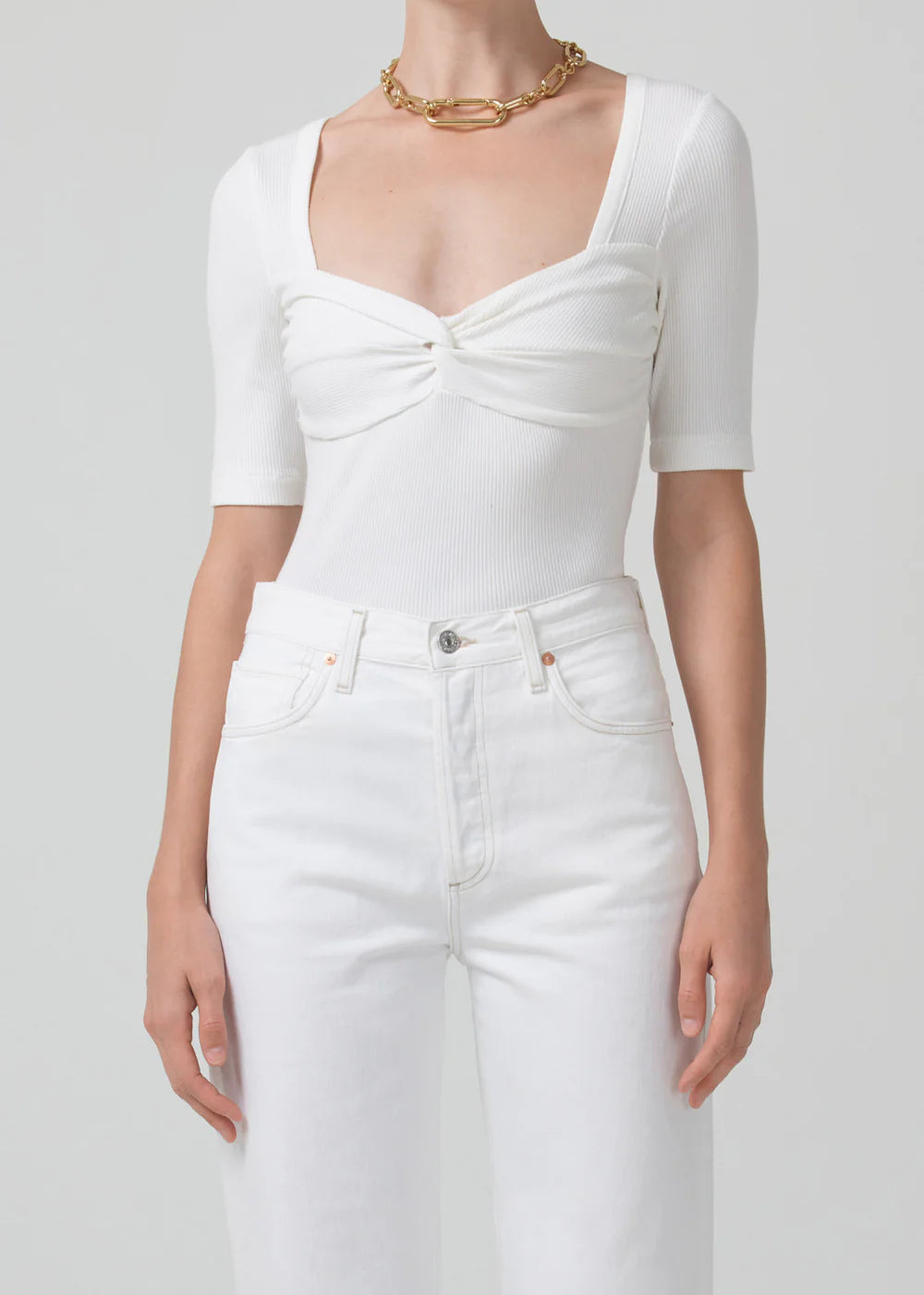 Citizens of Humanity Parie twist top in Milque off-white worn with white jeans, cropped front view