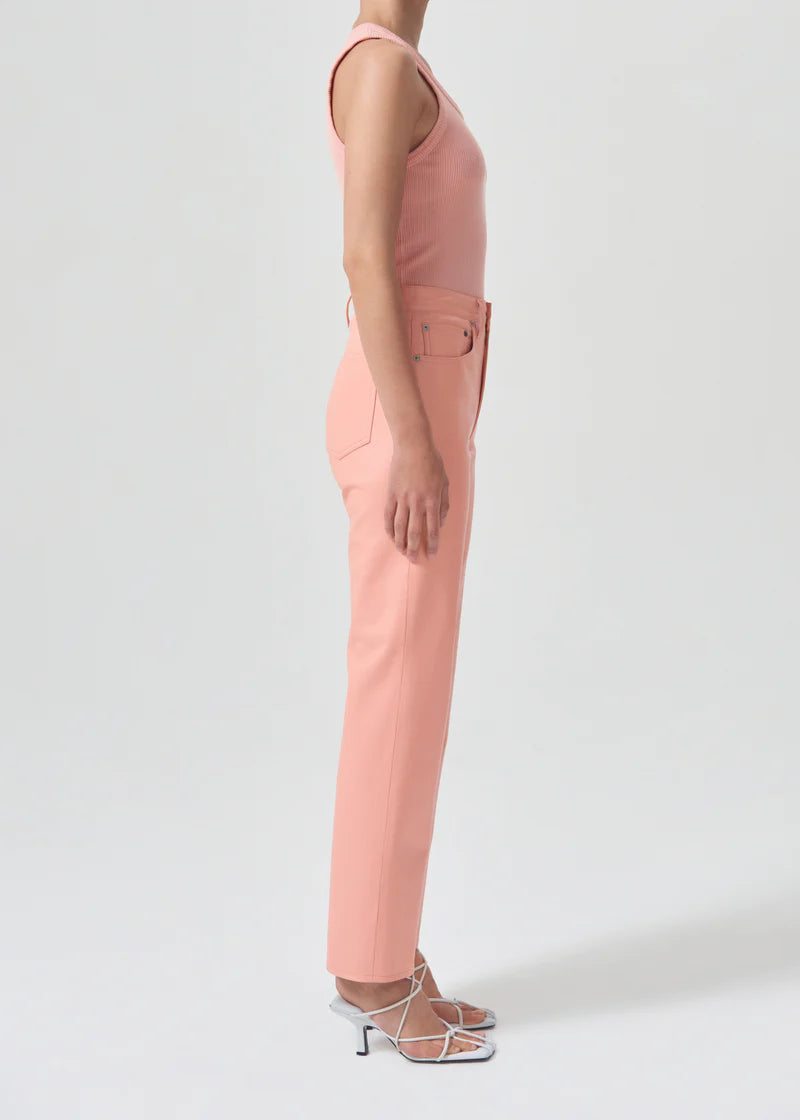 AGOLDE Poppy grapefruit pink ribbed scoop neck tank top worn with peach trousers, side view