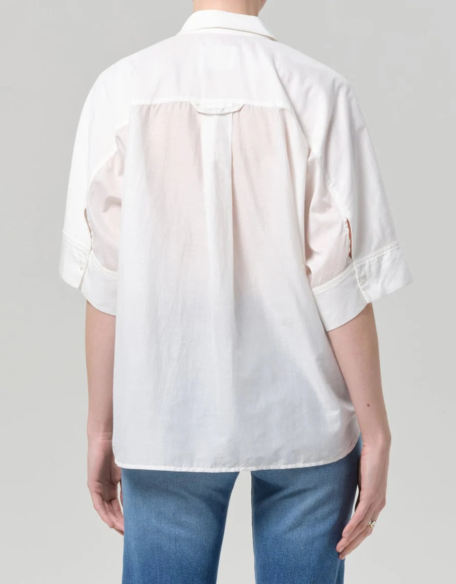 Back view of the white Claire shirt showing the back yoke and centre pleat