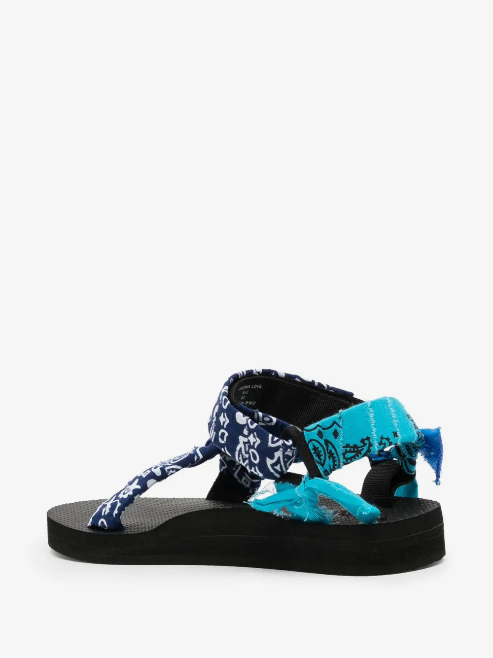 Three-quarter view of the Trekky sandals in Mixed Navy showing the ankle strap and bow details