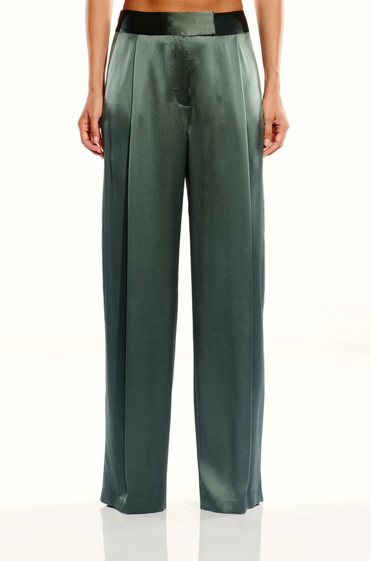 The Sei Relaxed Silk Trouser in Thyme, thyme green silk — front view on model