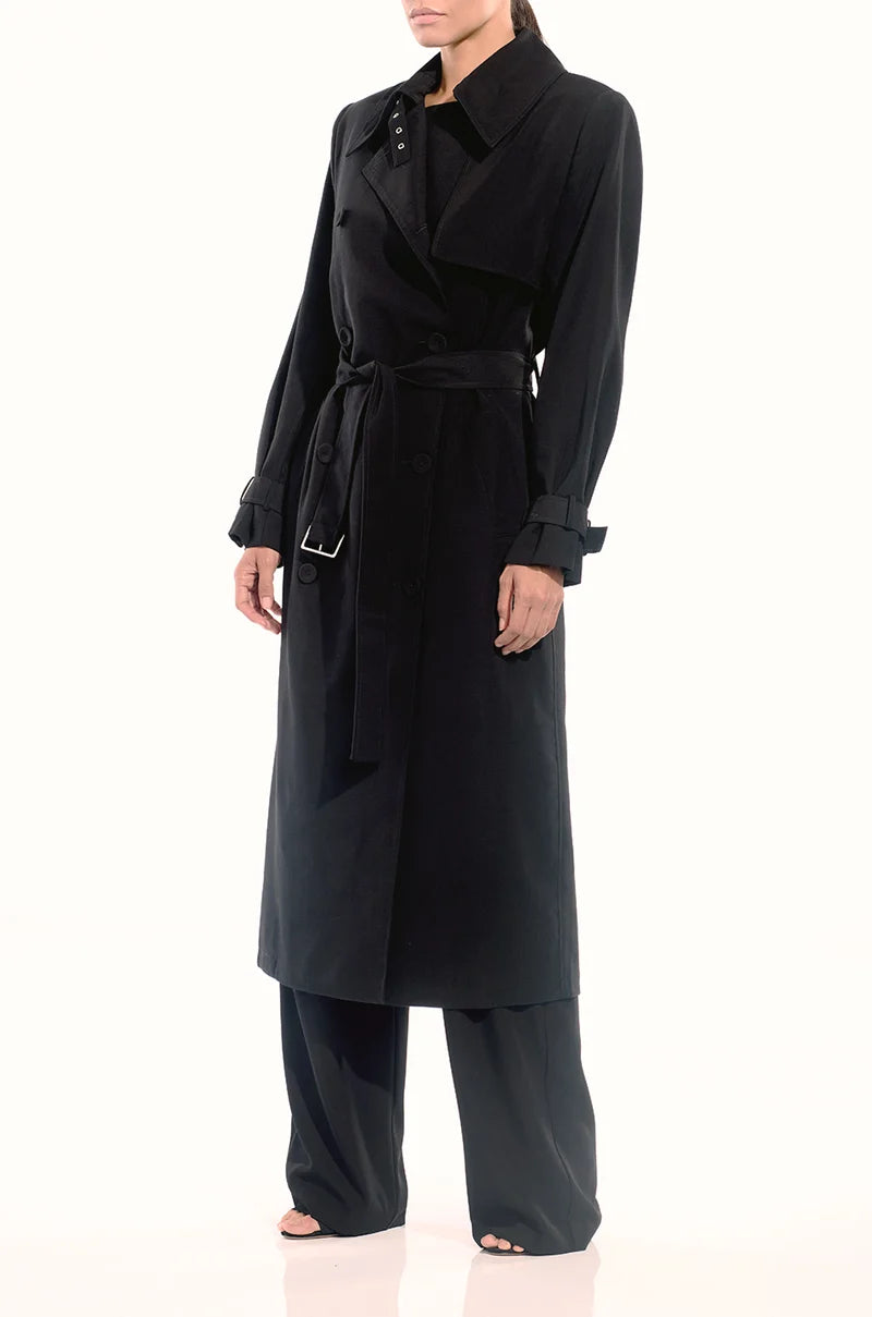 Side front view of The Sei structured trench coat in black with detachable waist belt