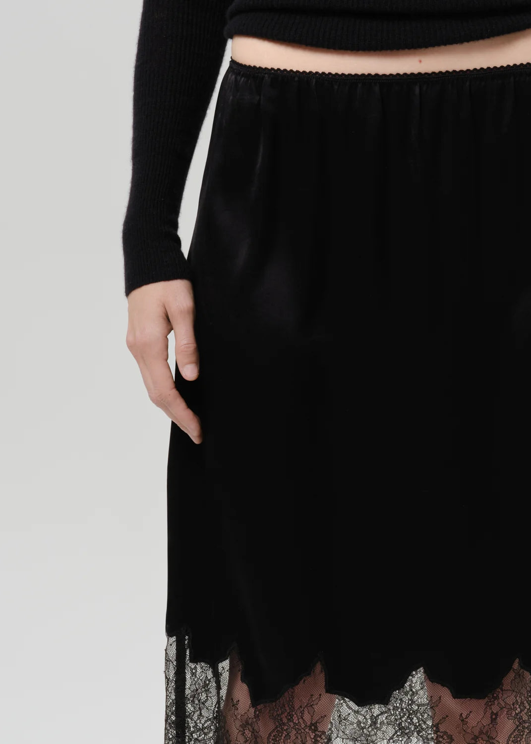 Citizens of Humanity Lace Trimmed Skirt in Black, waistband and lace hem detail close-up