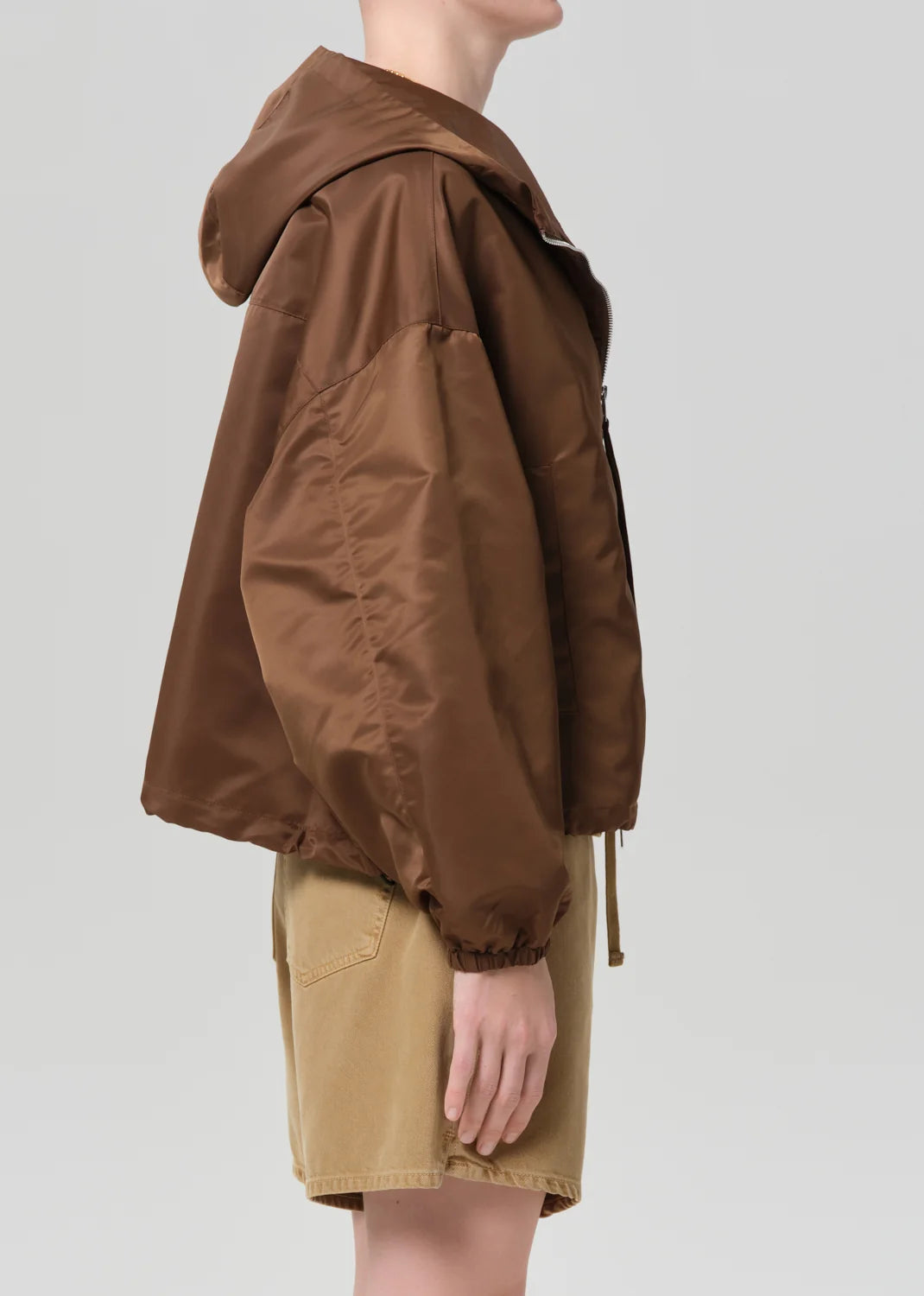 Citizens of Humanity Cropped Nylon Windbreaker in Brown, side view showing the hood