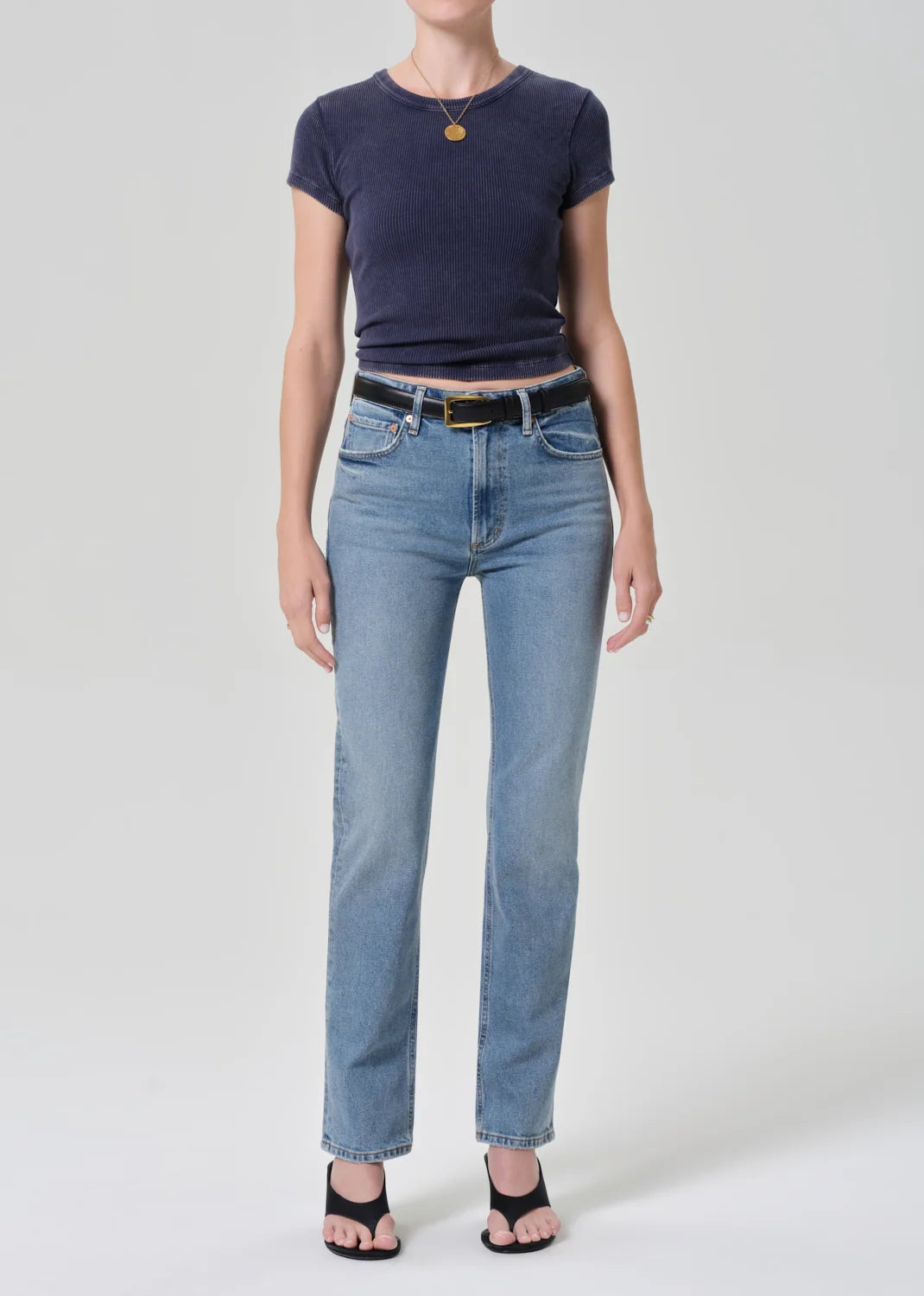 Full-length front view of the Nello tee in Mineral Navy worn with light-wash jeans