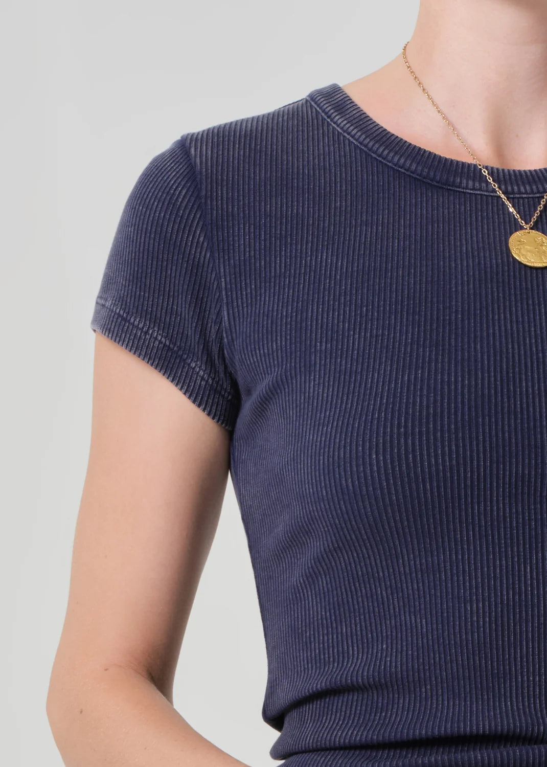 Close-up of the crew neckline and sweater rib on the Nello tee in Mineral Navy