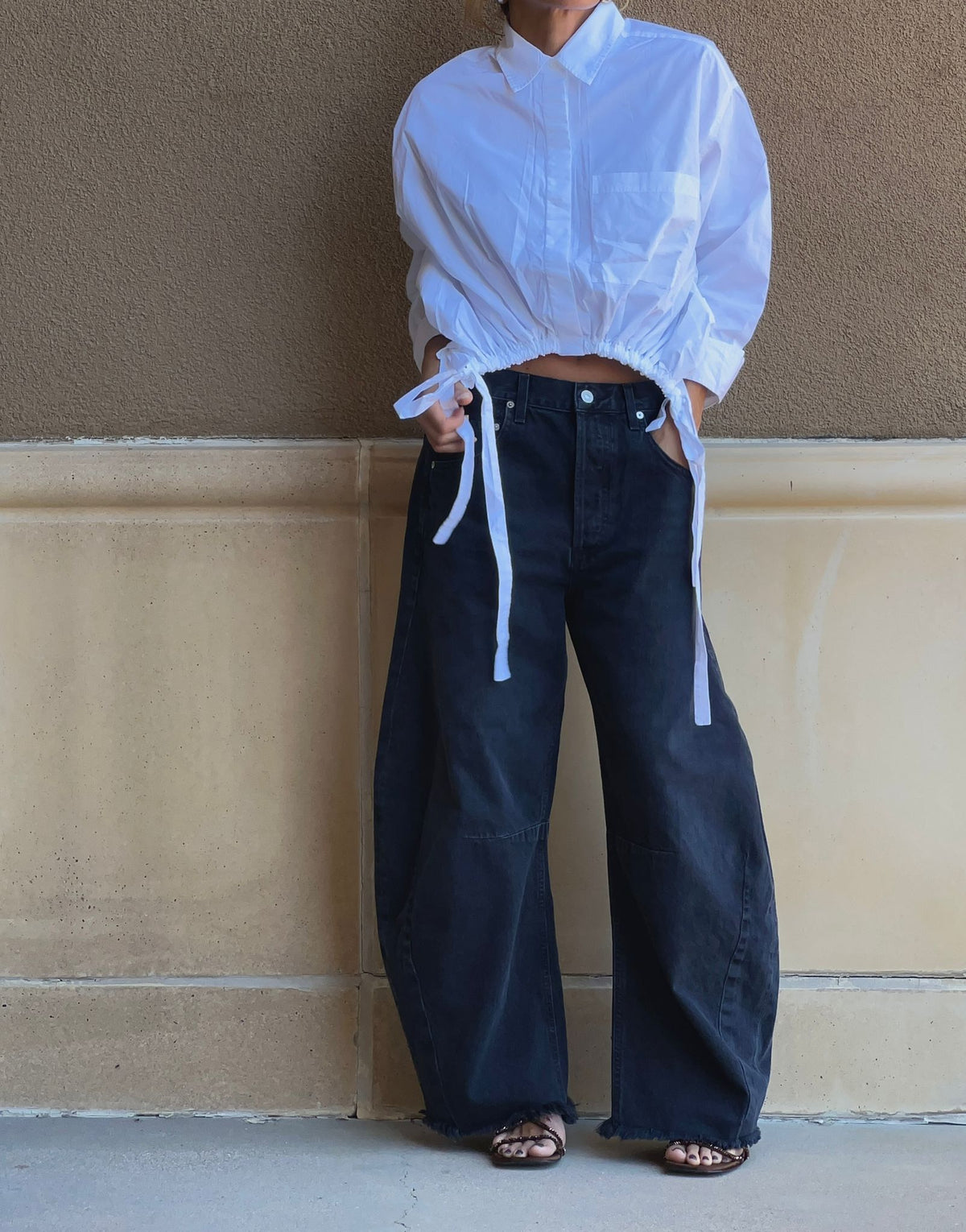 Personal shopping at RTND in Calgary — a styled look with a white tie-front shirt and wide-leg dark jeans