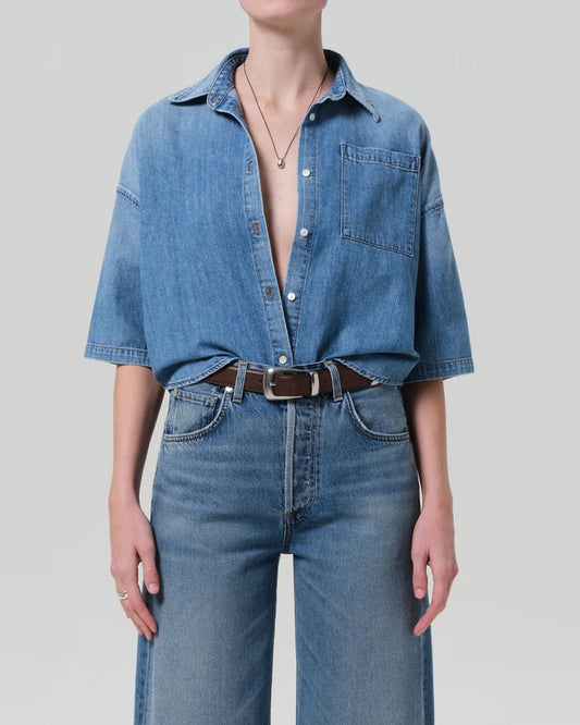 Citizens of Humanity Frances cropped cape button up shirt in Skyland light blue denim, front view, worn tucked into jeans