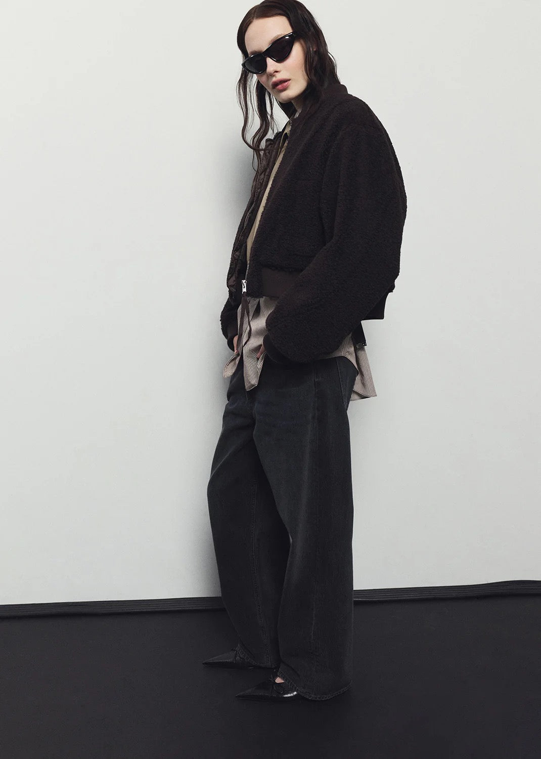 Model wearing AGOLDE Iona Skye Jacket in Chocolate — structured cropped fit