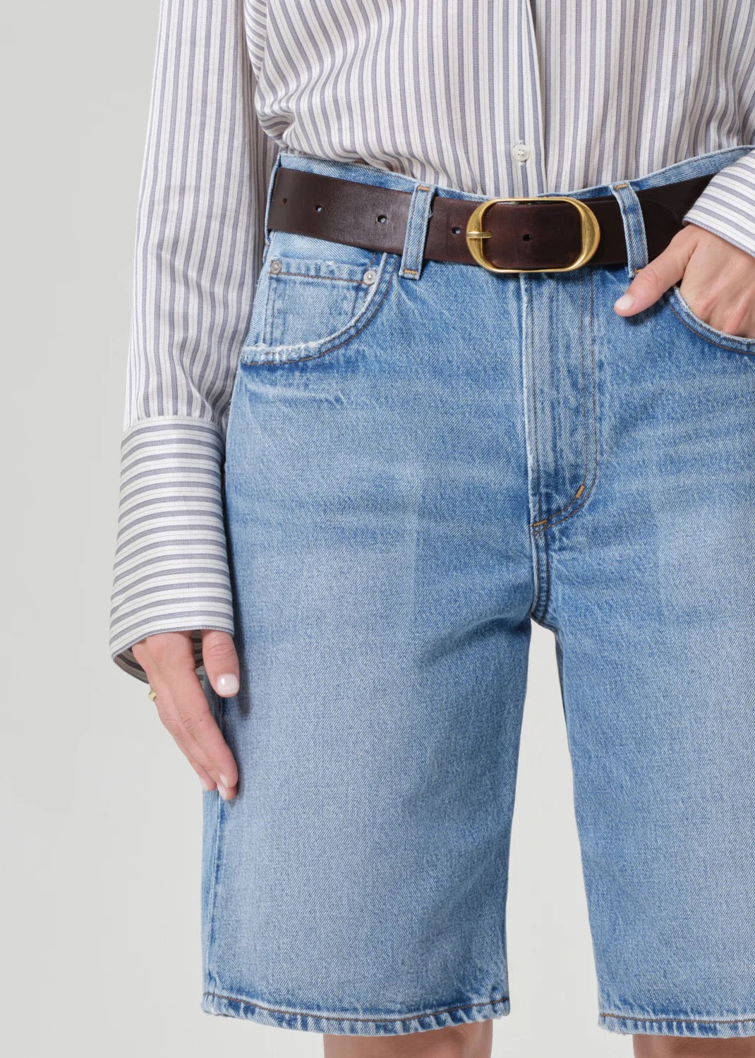 Close up of designer long denim shorts in regenerative cotton