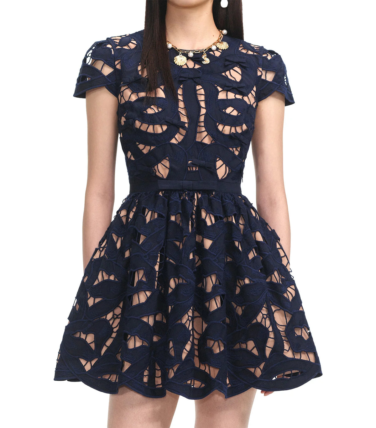 Front view of the navy bow embroidered mini dress showing the fitted bodice and cap sleeves