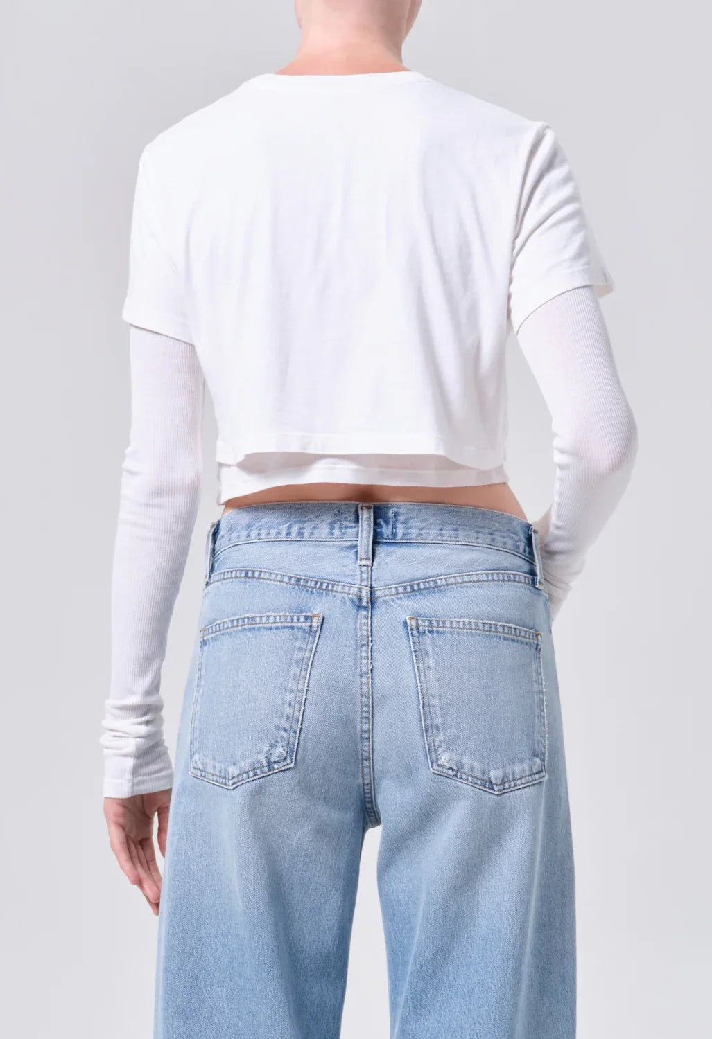 AGOLDE Romily Tee in White Ash, back view on model showing the layered cropped construction