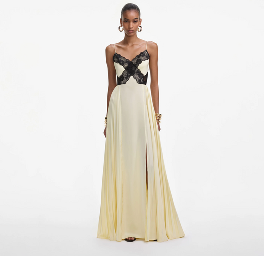 Front view of the Self-Portrait satin lace maxi dress in yellow with black lace bodice and pleated skirt