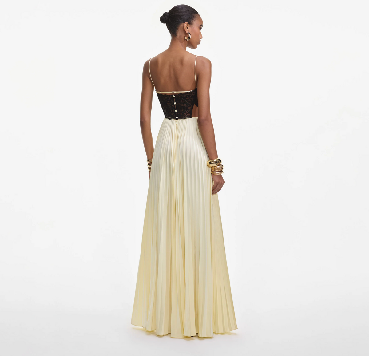 Back view of the Self-Portrait satin lace maxi dress in yellow, showing button closure and side cut-out