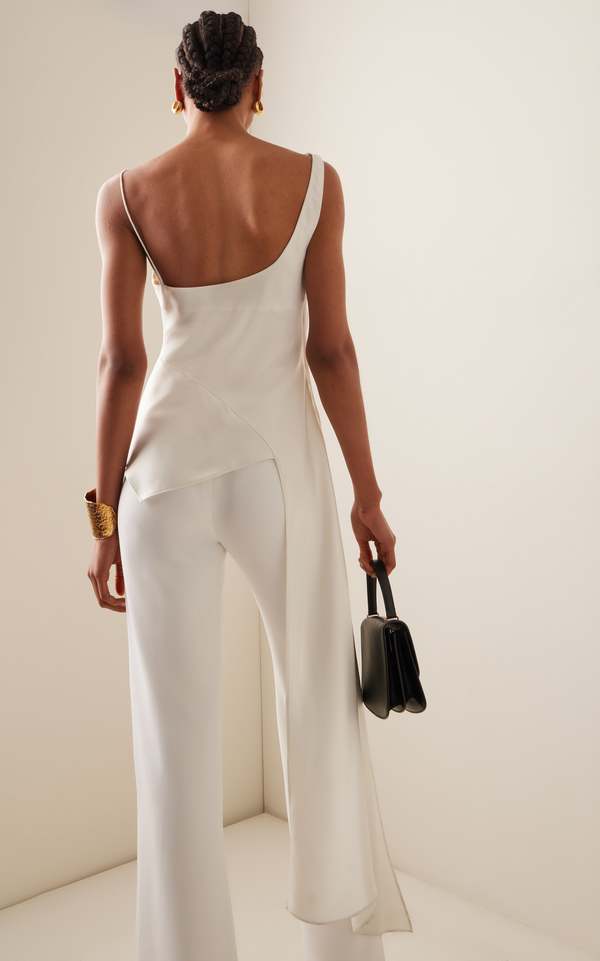 Back view of the ivory Ronnie satin top with a long draped side panel