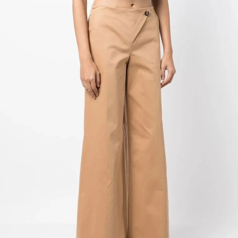 Front view of the Simkhai Rory wide-leg trousers in Nutmeg with an asymmetric wrap front