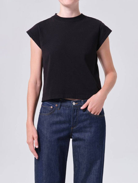 AGOLDE Bryce shoulder pad cap sleeve tee in black, front view, worn with jeans